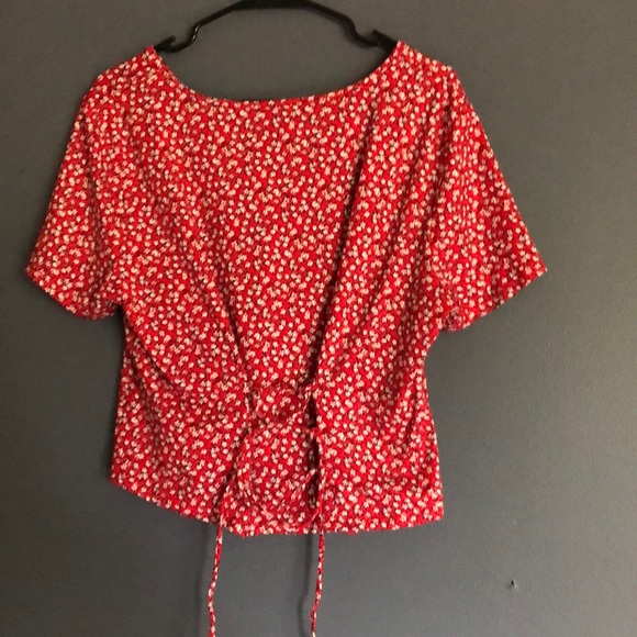 red w/ white flowers shirt with tie in the back. - Picture 2 of 4